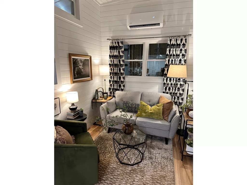 Sofa in living area showing slip unit above windows