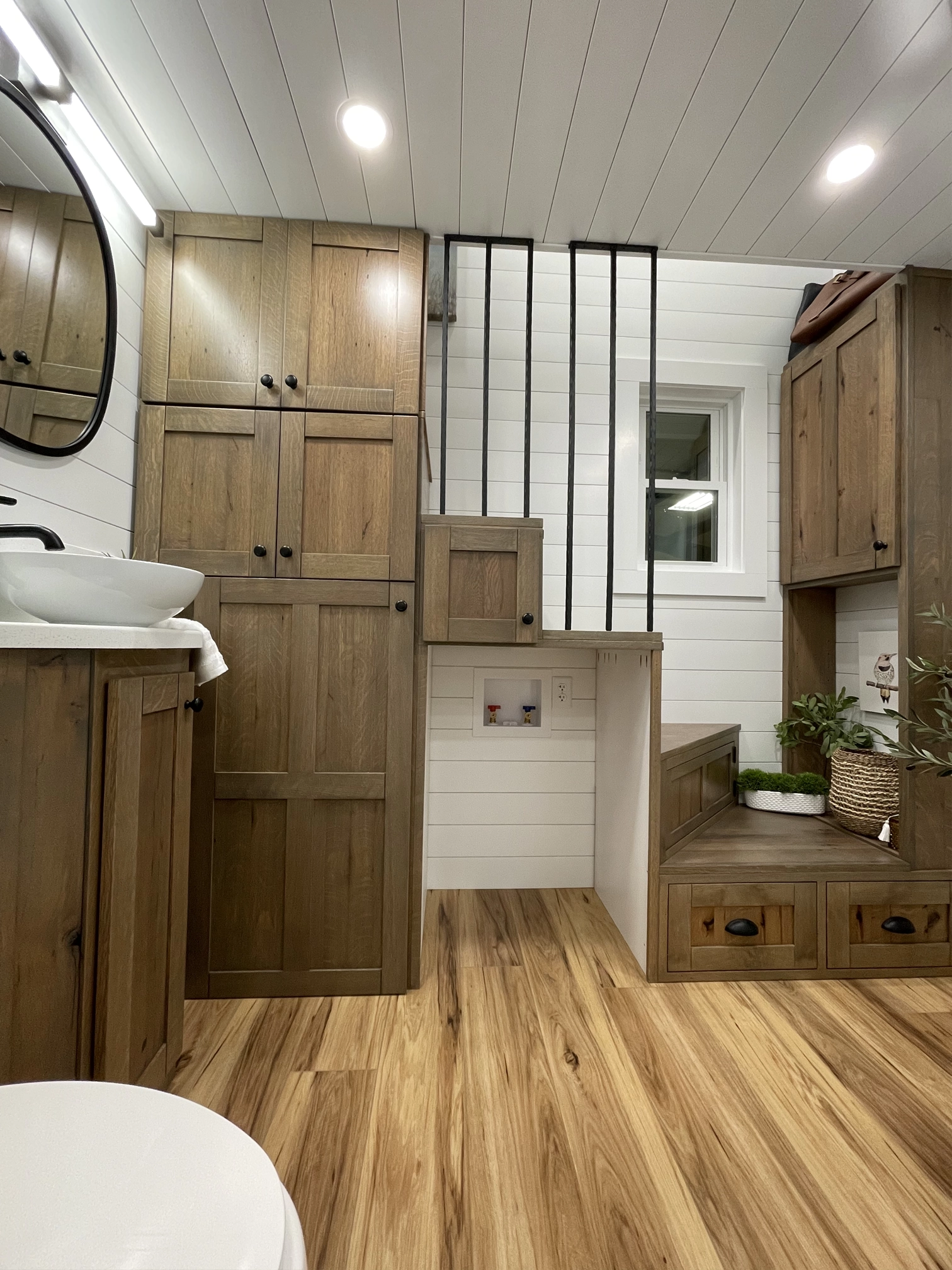 View of stairs to loft with storage cabinets